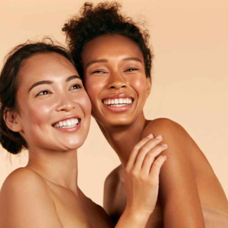 Happy pair of women with clear skin